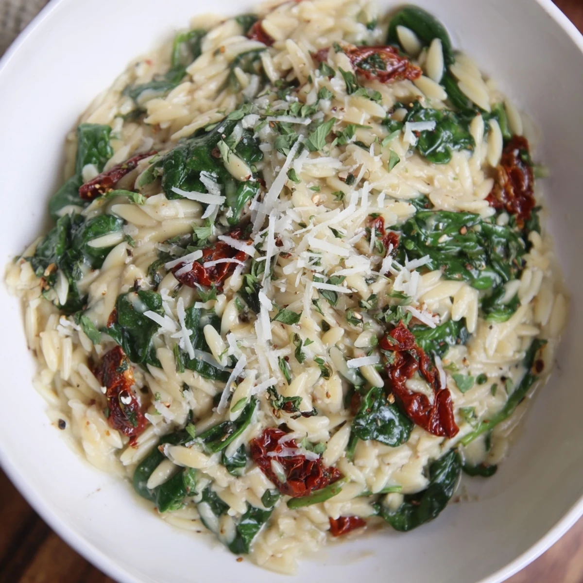 Close-up of a warm, rich Creamy Tuscan Orzo Bowl, perfect for a cozy weeknight dinner.