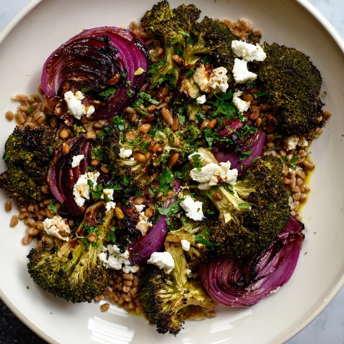 Warm roasted broccoli with garlic-lemon & farro, a vibrant and flavorful Mediterranean-inspired vegetarian recipe.