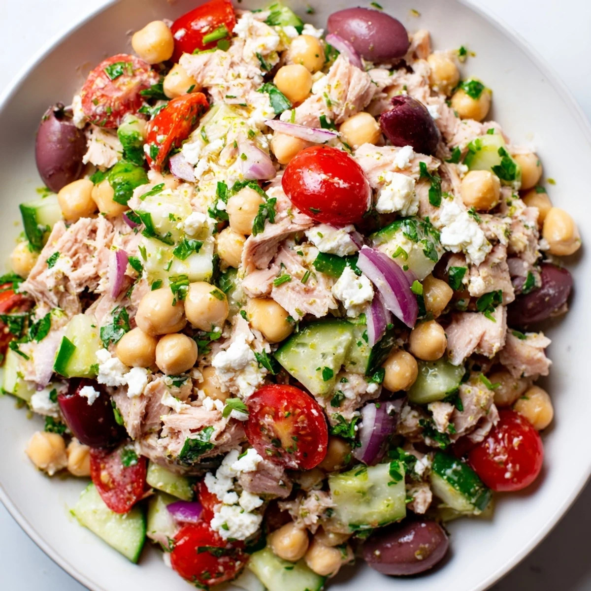 A colorful Tuna Chickpea Salad bowl with fresh tomatoes, perfect for a quick lunch.