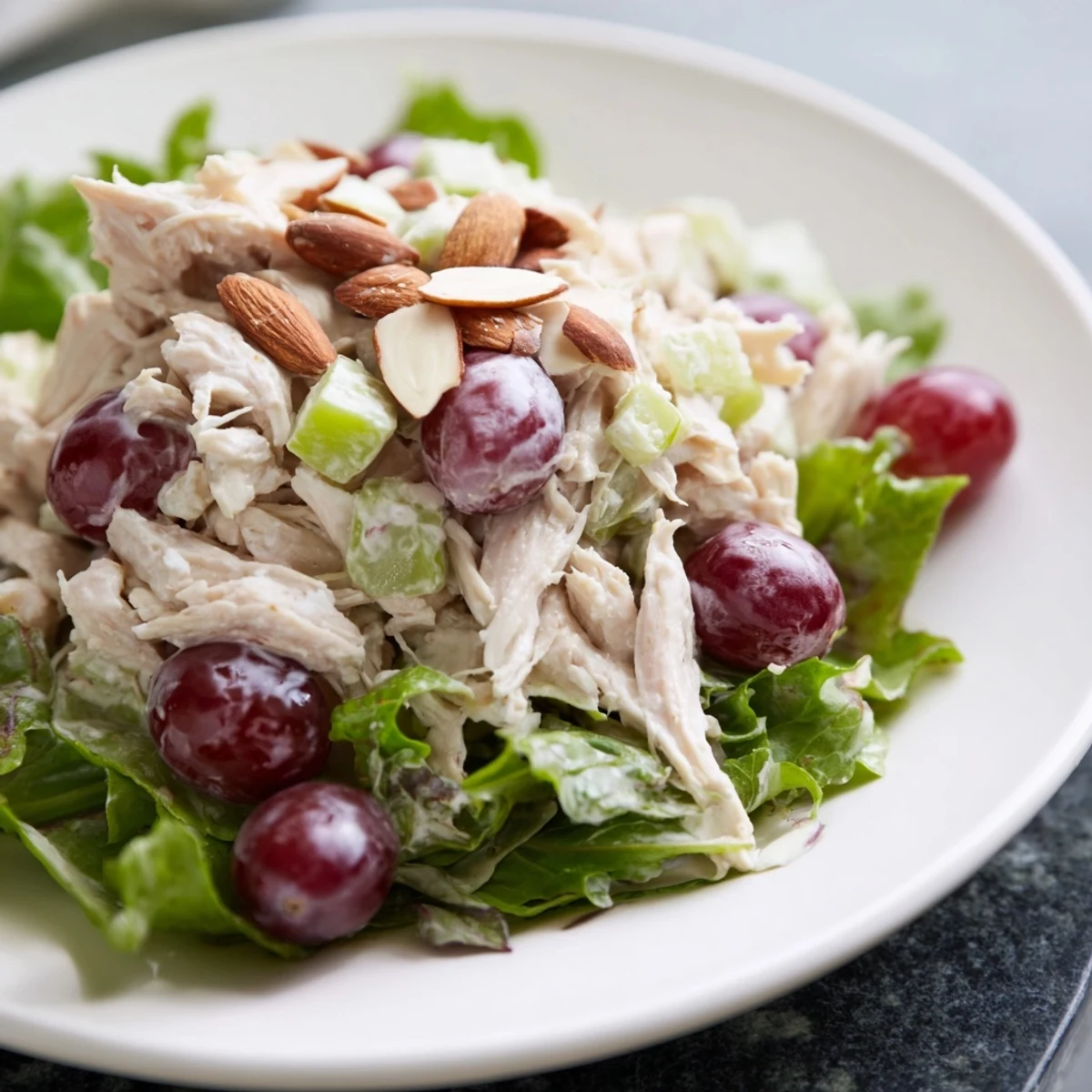Close-up of a flavorful crispy chicken salad, a refreshing main dish with creamy dressing.