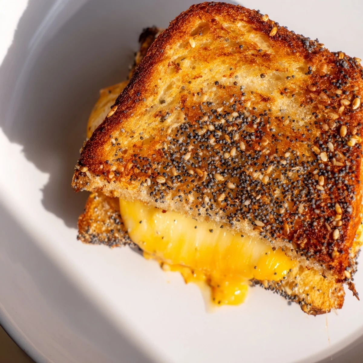 Crusty Everything Bagel Grilled Cheese, golden brown with melted cheese, perfect for a cozy lunch.
