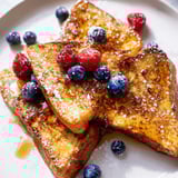 Thick-cut, buttery ice cream French toast ready to be devoured for a delicious brunch.