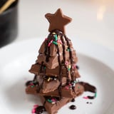 Melted chocolate drizzled over festive Chocolate Kinder Christmas Trees, topped with edible stars.