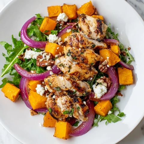 Sheet pan Roasted Chicken & Winter Squash Salad with golden squash and juicy chicken, ready to serve.