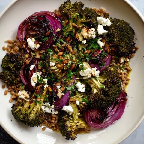 Warm roasted broccoli with garlic-lemon & farro, a vibrant and flavorful Mediterranean-inspired vegetarian recipe.