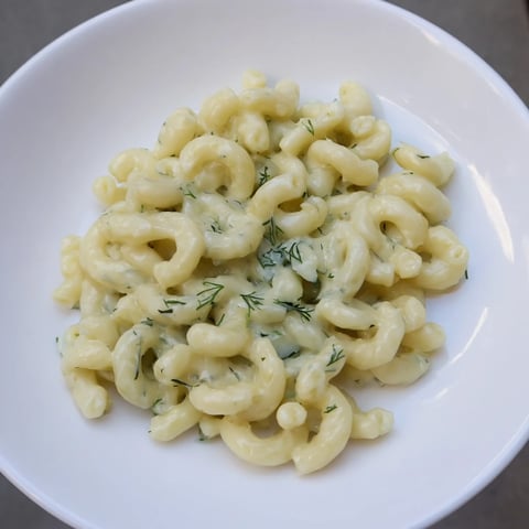 Golden brown Pickle Mac and Cheese boasts a creamy, dill-infused sauce and cheesy goodness.