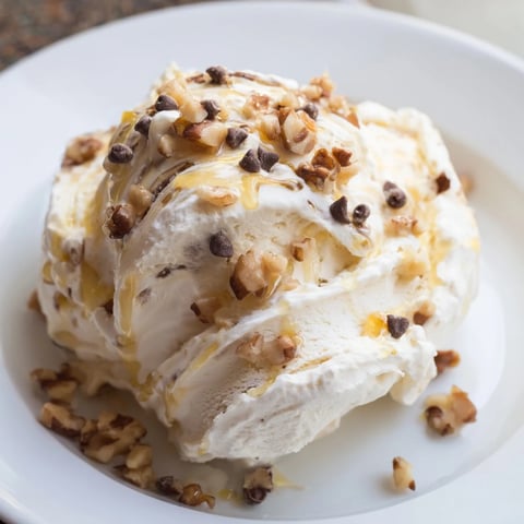 Creamy cottage cheese ice cream swirled with fresh berries, a delightful, protein-packed dessert.