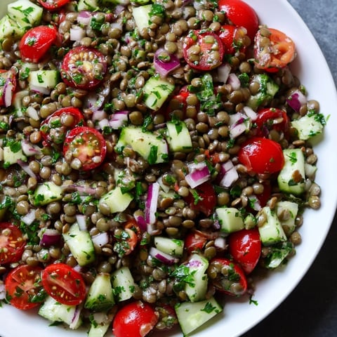 A colorful lentil salad, tossed with fresh veggies and a tangy mustard vinaigrette.