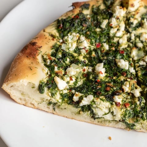 Golden Turkish Spinach & Feta Flatbread, filled with a warm, savory spinach and feta filling, ready to serve.