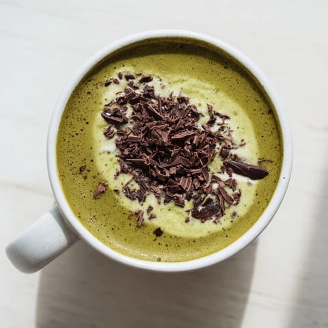 The rich aroma of this Collagen Peppermint Mocha Matcha Latte hints at a warm, minty, and chocolatey treat.