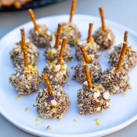 Savory Champagne Cork Cheese Balls, shaped like mini corks, perfect for your holiday party spread.