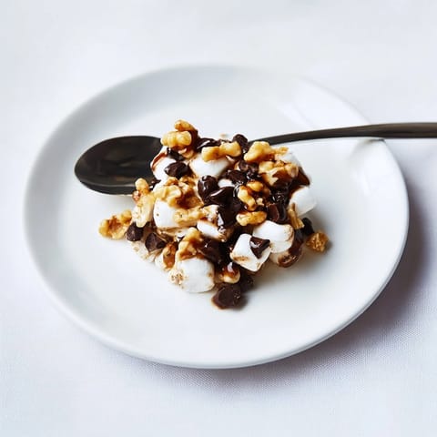 Melting mini marshmallows embracing chocolate chips, creating a super easy, quick dessert recipe.
