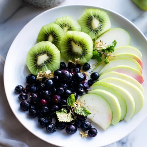 Fresh blackberries and grapes star in this stunning The Aurora Borealis Sweep appetizer, a colorful treat.