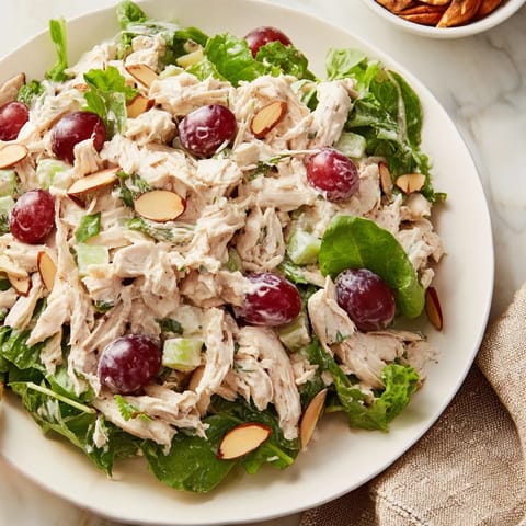 This vibrant image shows a delicious crispy chicken salad served on crisp salad greens, perfect.