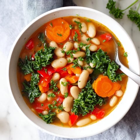 Savory Mediterranean White Bean Stew, perfectly seasoned and rich with olive oil broth.