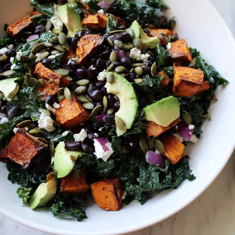 Enjoy a healthy serving of Massaged Kale Salad with its zesty lime dressing and sweet potato.