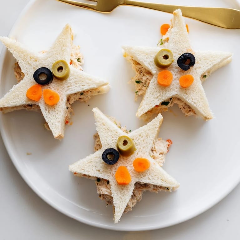 Eye-catching close-up of delicious Mini Starfish Sandwiches, the perfect easy appetizer, served cold.