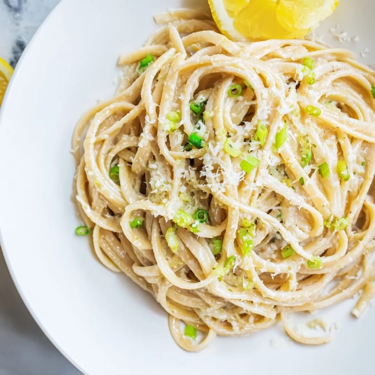 A plate of flavorful miso butter pasta, served and garnished with fresh chives, a quick weeknight dinner.