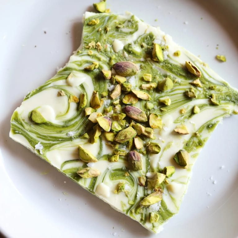 Enjoy the sweet and nutty Pistachio Matcha White Chocolate, a visually appealing dessert, perfect for any occasion at home.