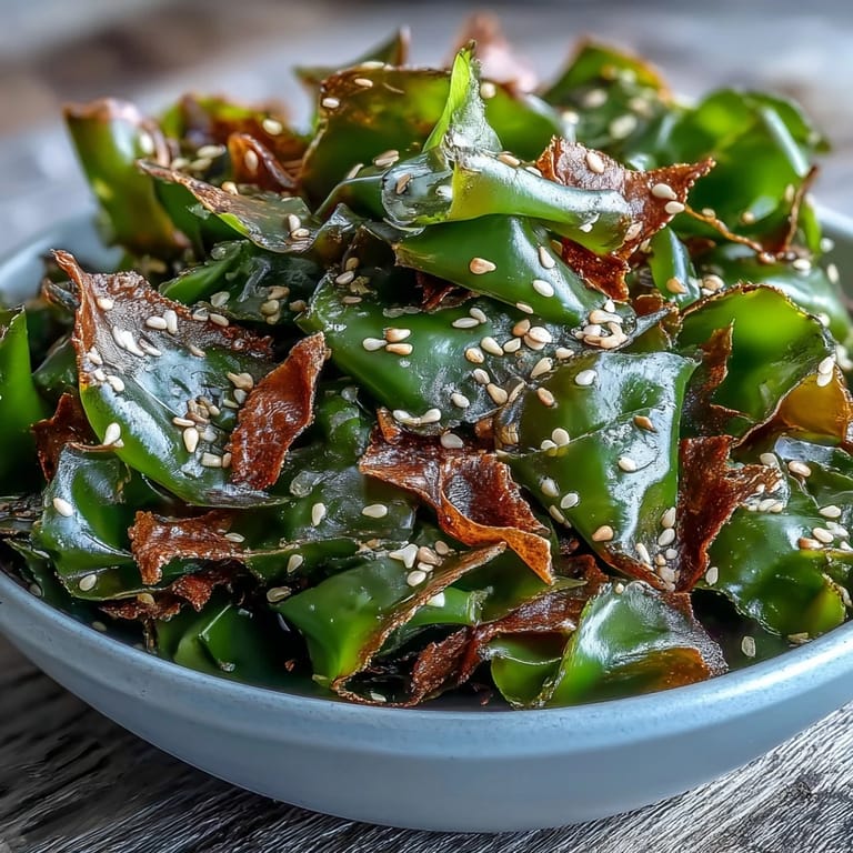 Golden seaweed snack chips, lightly salted with sesame for a satisfying crunch.