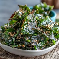 Crispy seaweed snack chips with sesame seeds, a savory, baked delight.